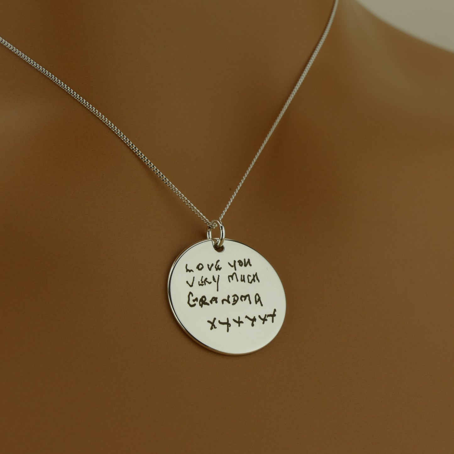 Detailed engraving of actual handwriting on sterling silver pendant