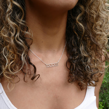 Model Wearing Sterling Silver Roman Numeral Necklace